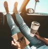 X_Woman_in_Car_with_coffee_and_travel_book_iStock-1142812695-395x270 - Credit: KIWI TOURS GmbH
